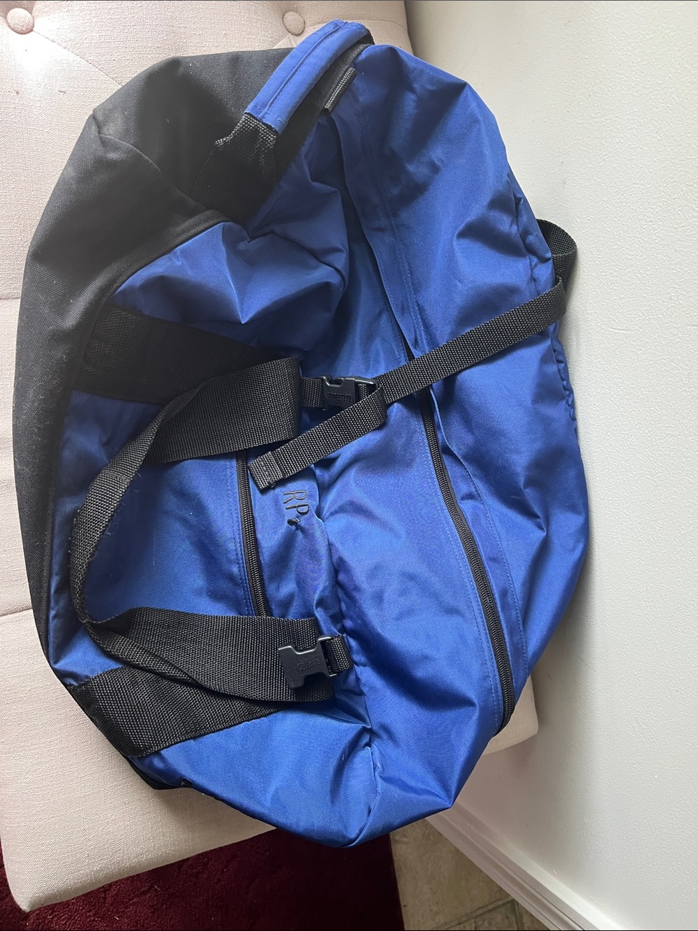 Blue and Black Duffel Bag one clip is broken. 10” x 20” x12”approximately